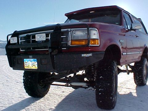 1995 Ford Bronco - This 1995 Ford Bronco is equipped with an aftermarket bumper and grille guard, seen here in a snowy landscape.