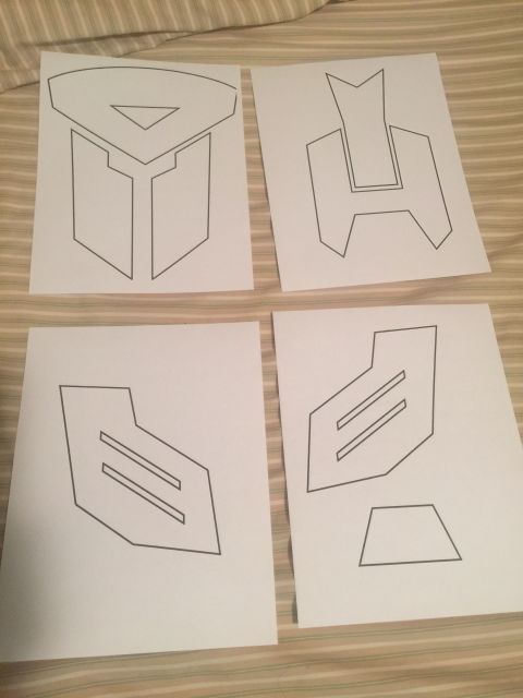 1993 Ford Bronco - Paper cutouts of logos are laid out on a striped surface, with a website URL visible at the bottom.