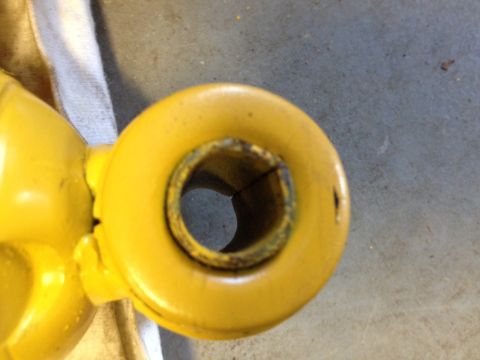 1973 Ford Bronco - Close-up view of a yellow shock absorber end, showing wear and a Supermotors.net watermark.