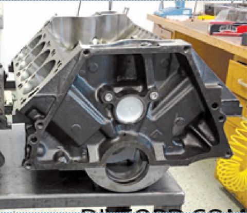 1973 Ford Ranchero - Engine block shown from the front, mounted on a stand in a workshop environment.