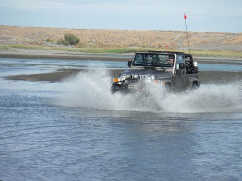 2005 Jeep Wrangler - 2005 Jeep Wrangler driving through water with a large splash.