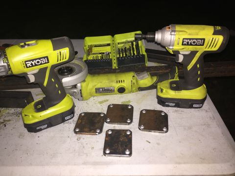 1993 Ford Bronco - A collection of Ryobi power tools and metal plates are laid out on a table, ready for a project.
