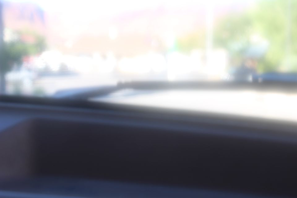 View from inside a vehicle looking out the windshield.