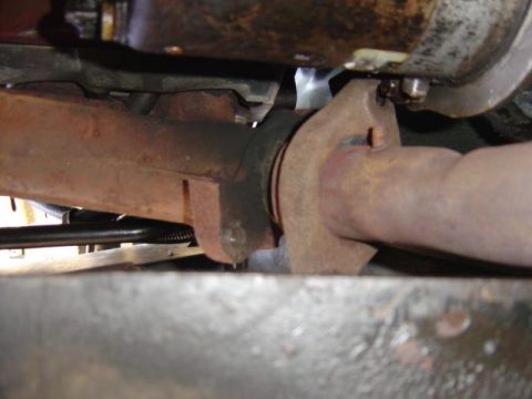 1986 Ford Bronco - This is a close-up view of the exhaust system's manifold and pipe connection, showing significant rust.