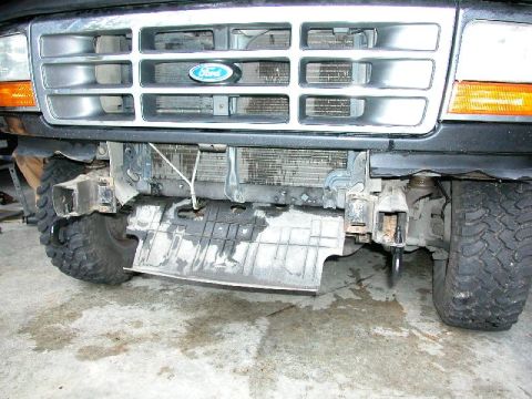 1995 Ford Bronco - Front view of a 1995 Ford Bronco showing the grille, radiator, and bumper damage.