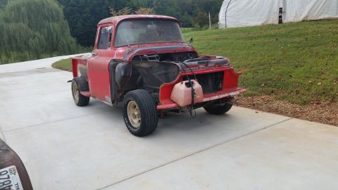 2015 Chevrolet new - This red pickup truck, likely from the mid-1950s, is missing its hood and appears to be undergoing restoration.