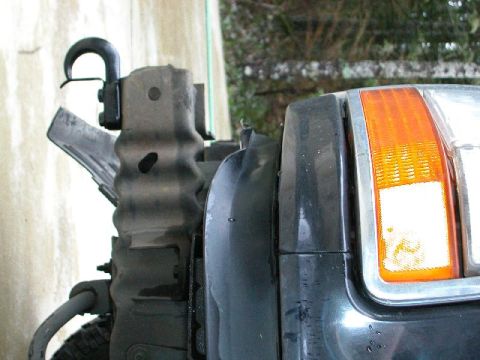 1995 Ford Bronco - Front recovery hook and headlight assembly on a 1995 Ford Bronco.