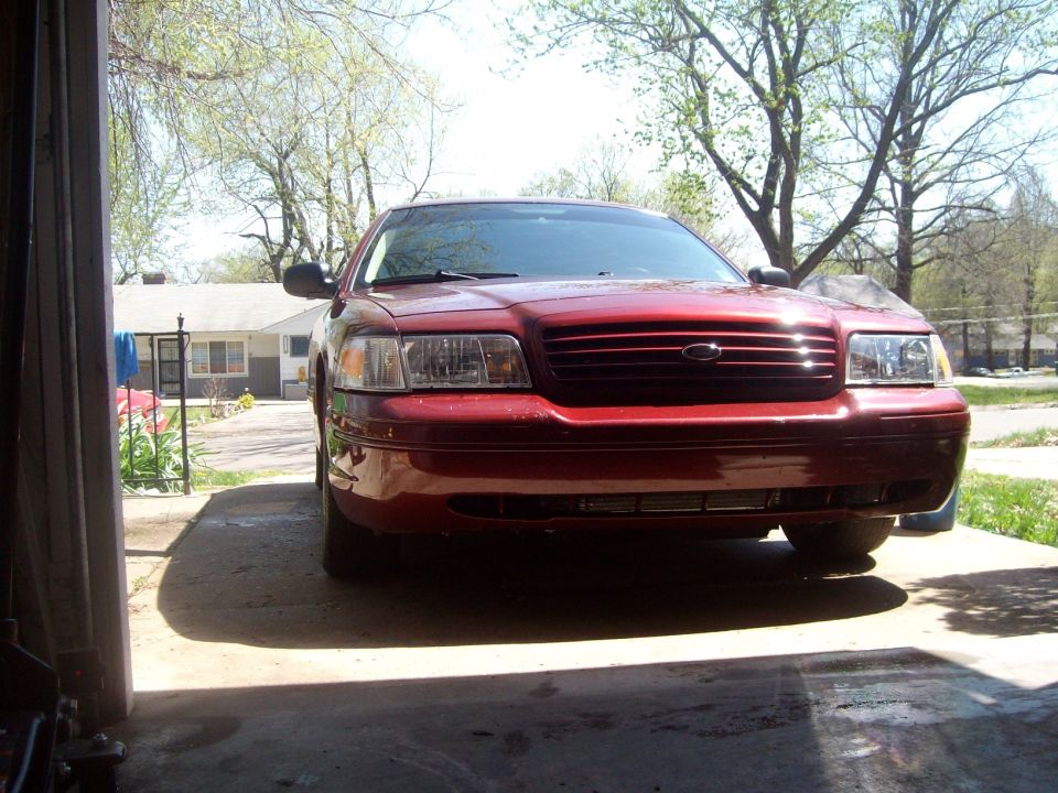 Red 2004 Ford Crown Victoria front view