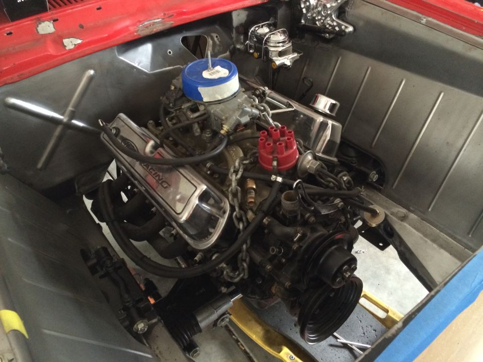 1964 Ford Fairlane engine bay with V8 engine and chrome valve covers