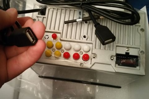 2001 Ford Excursion - Back of car stereo with multiple input/output ports and USB connection. Label indicates WiFi antenna connection.