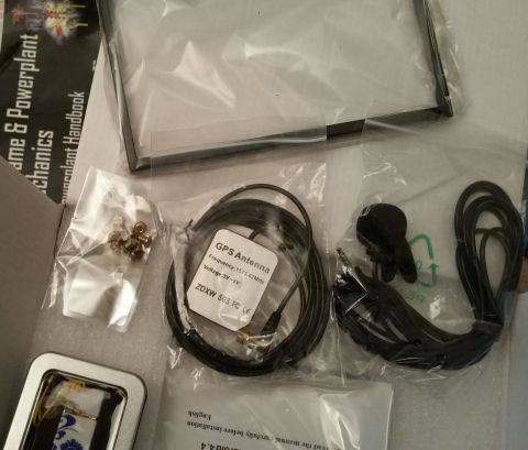 2001 Ford Excursion - Various electronic accessories, including a GPS antenna, are laid out in their packaging.