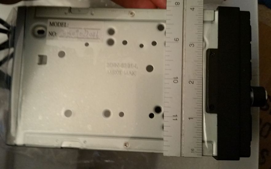 Car stereo chassis with ruler measuring its width. Text reads '2DIN-0231-1-'