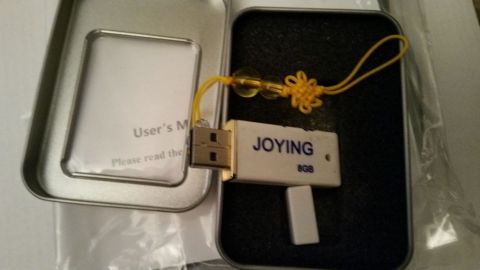 2001 Ford Excursion - A "JOYING" brand 8GB USB flash drive is shown with its user manual and packaging.