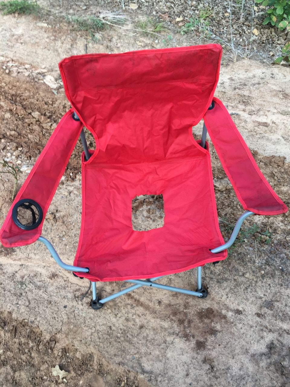 Red folding camping chair with cup holders