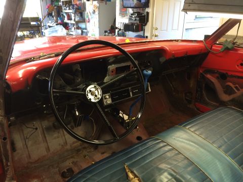 1964 Ford Fairlane - Interior view of a 1964 Ford Fairlane undergoing restoration, with exposed metal and parts.
