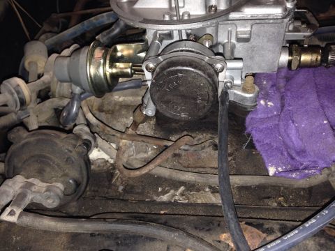 1979 Ford Bronco - Engine bay detail showing carburetor and associated plumbing. No specific vehicle year identified.