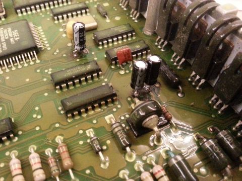 1994 Ford Bronco - Electronic circuit board with multiple integrated circuits, capacitors, and resistors visible.