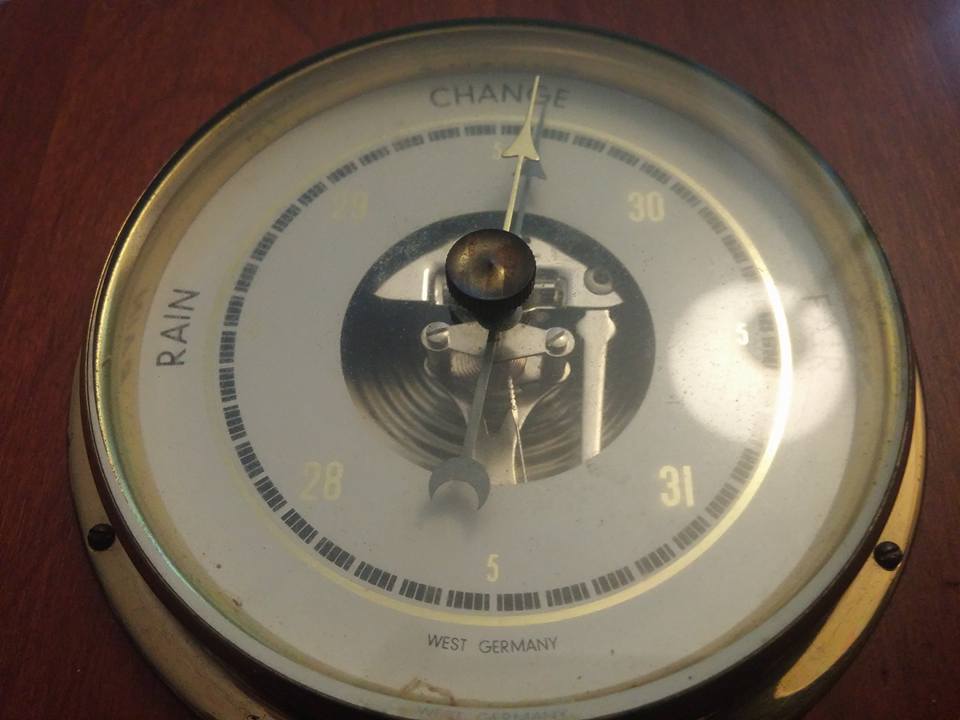 Barometer gauge with markings for RAIN and CHANGE, and numbers 28, 30, 31. Text reads WEST GERMANY