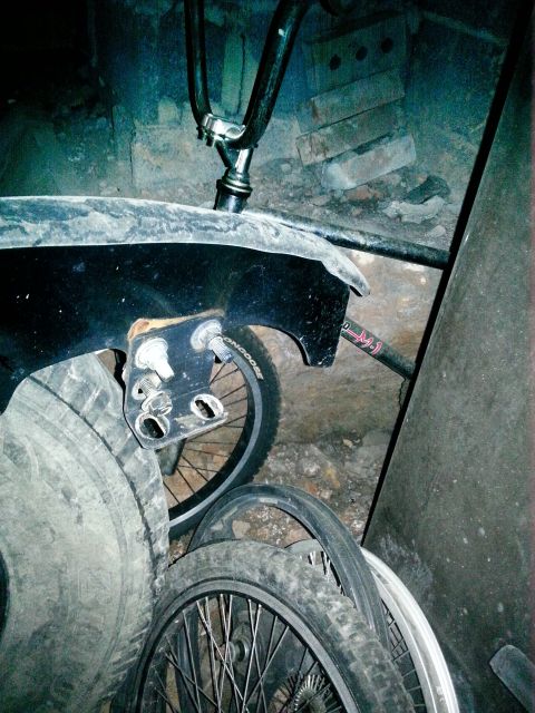 1994 Ford Bronco - Close-up of bicycle parts and tires stored in a cluttered area.
