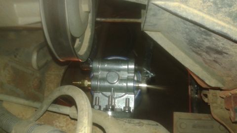 1996 Ford Bronco - Close-up of an engine oil filter housing with visible plumbing and mounting hardware.