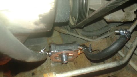 1996 Ford Bronco - A remote oil filter adapter is shown installed with hoses connected.