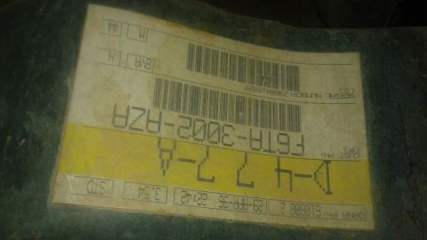 1996 Ford Bronco - A close-up of a part identification label with various codes and barcodes is shown.