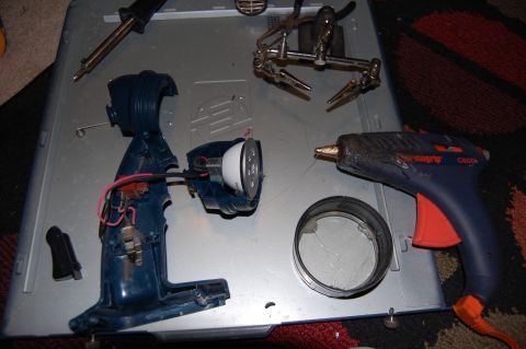 1994 Ford Bronco - Tools and parts laid out for a DIY project involving a disassembled flashlight.