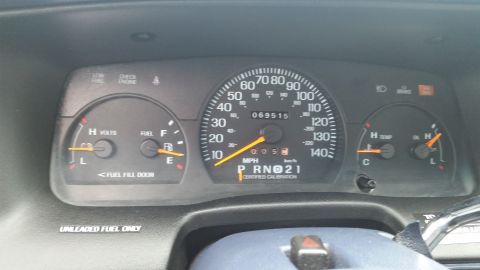 1991 Ford LTD Crown Victoria - Photo of a vehicle instrument cluster and odometer, not a technical document.