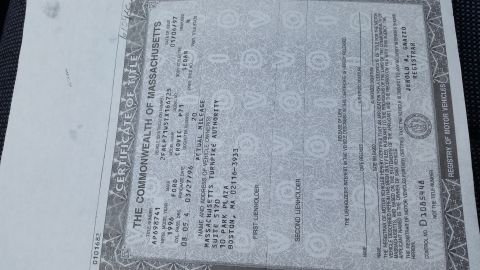1991 Ford LTD Crown Victoria - Scanned Commonwealth of Massachusetts Certificate of Title showing vehicle make, year, mileage and owner details.