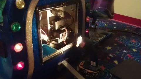 1994 Ford Bronco - The interior of a vehicle's control panel is open, revealing wiring and components. Several colored lights are visible on the exterior of t…