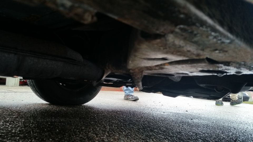 Undercarriage view of suspension and floor pan