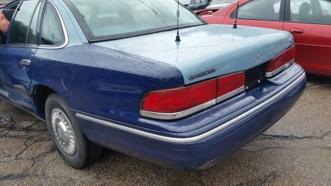 1991 Ford LTD Crown Victoria - Photo of the rear quarter and taillights of a two-tone blue Crown Victoria, not a document.
