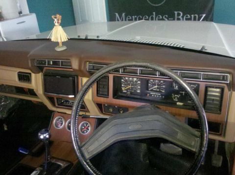 1982 Ford Bronco - Dashboard view shows an aftermarket radio and auxiliary gauges in a vintage Ford vehicle.