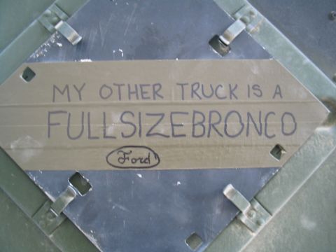 1981 Ford Bronco - A metal plate displays the text "MY OTHER TRUCK IS A FULLSIZE BRONCO" along with a Ford logo.
