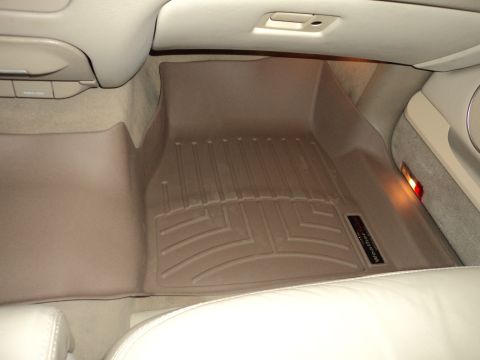 2004 Mercury Grand Marquis - Tan WeatherTech floor mats are installed in the interior of a vehicle.