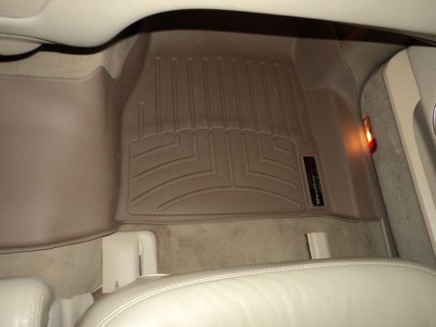 2004 Mercury Grand Marquis - Tan WeatherTech floor mats installed in the interior of a vehicle.