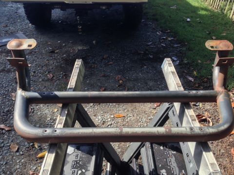 1979 Ford Bronco - Custom steel tube bumper assembly supported by sawhorses outdoors.
