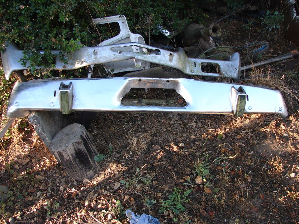 Chrome bumper with rectangular cutout and two vertical guards