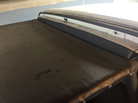 1995 Ford Bronco - The image shows a close-up of a truck bed cover, not a 1995 Ford Bronco.