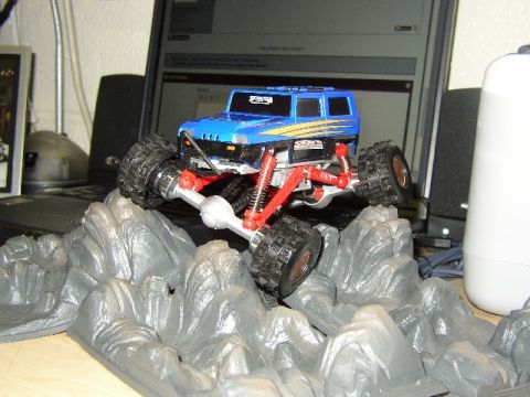 1989 Ford Bronco - This remote-controlled rock crawler toy is navigating a simulated rocky landscape.