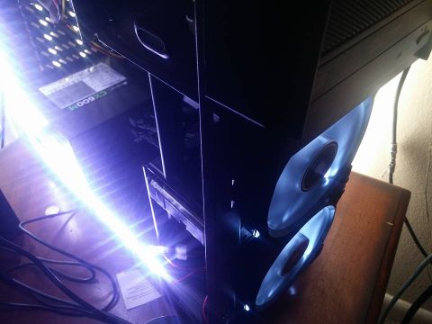 2000 Mercury Grand Marquis - A computer case with internal blue lighting and visible fans is shown on a desk.