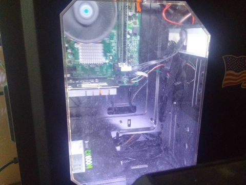 2000 Mercury Grand Marquis - Computer case interior with visible motherboard, fan, and wiring. Includes an American flag sticker.