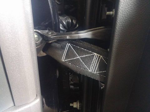 2000 Mercury Grand Marquis - A seatbelt anchor point is visible, attached to the vehicle's frame.