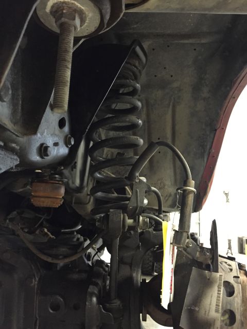 1984 Ford Bronco - Close-up of suspension parts, not a full vehicle view.