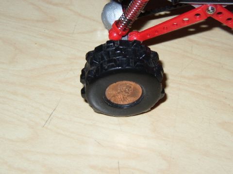 1989 Ford Bronco - A penny is used as a wheel weight on a toy RC car's tire.