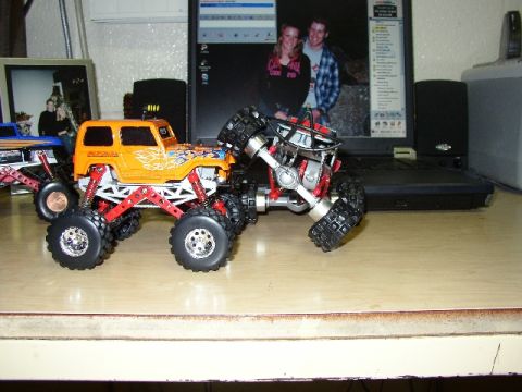 1989 Ford Bronco - This orange remote control monster truck features flame decals and an extreme suspension system.