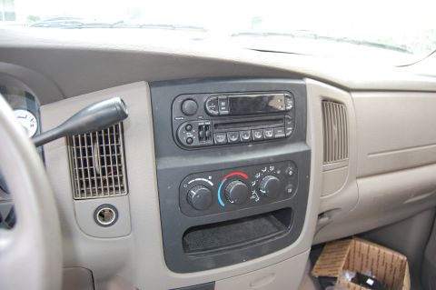 1994 Ford Bronco - Interior view of a vehicle's dashboard, focusing on the center console with the radio, climate controls, and gear shifter.