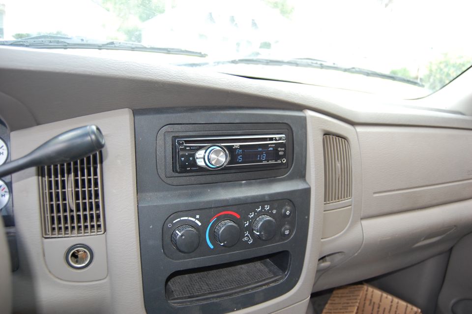 Interior dashboard of a vehicle with JVC car stereo and climate controls.