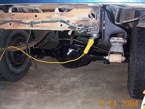 1986 Ford Bronco - axle in place. Also check out the cleaned up trailer harness.