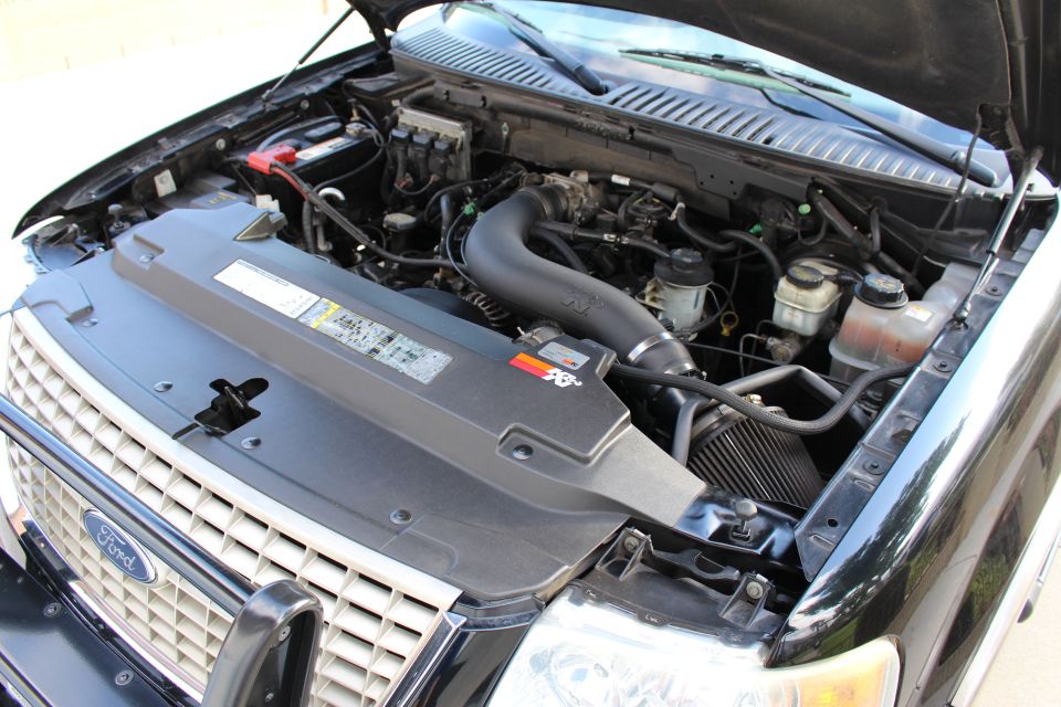 Black Ford Expedition engine bay with K&N air intake, viewed from front right